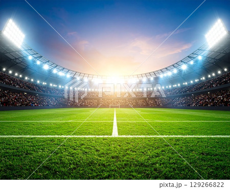 夕暮れのスタジアムと緑の芝が広がるサッカー試合の臨場感ある風景 夕暮れのスタジアムと緑の芝が広がるサッカー試合の臨場感ある風景 129266822
