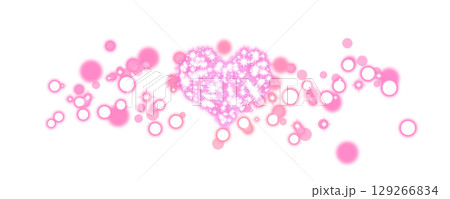 透明背景のピンクのキラキラハートと発光する玉 129266834