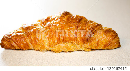 Croissant on White Background Fresh and Flaky Pastry Croissant on White Background Fresh and Flaky Pastry 129267415