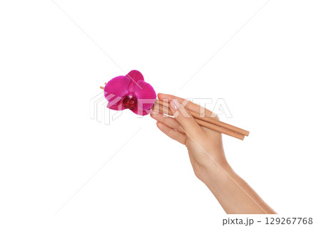 Pink orchid held with chopsticks, isolated on white, PNG Pink orchid held with chopsticks, isolated on white, PNG 129267768
