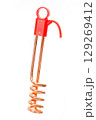 Copper immersion water heater with red plastic handle isolated on white background, used for quick water heating. 129269412