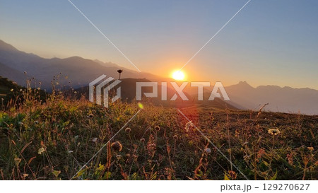 A breathtaking sunset in the majestic mountains of the Caucasus. 129270627