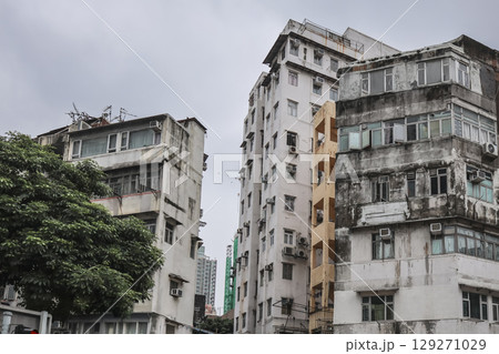Aug 3 2025 Urban Apartment Building Exterior with Numerous Windows Aug 3 2025 Urban Apartment Building Exterior with Numerous Windows 129271029