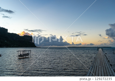 Sunset over the tranquil lagoon of Maupiti, French Polynesia Sunset over the tranquil lagoon of Maupiti, French Polynesia 129272235