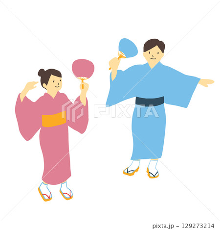 うちわを手にもち、浴衣姿で盆踊りを踊る男女 129273214