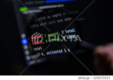 Dark computer screen displays programming test results showing 'failed' and 'passed' counts, symbolizing software development, debugging, and quality assurance 129273815
