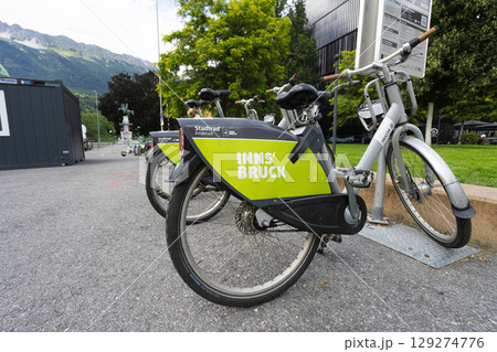 Rental bikes on a city center sidewalk in Innsbruck, Austria 129274776