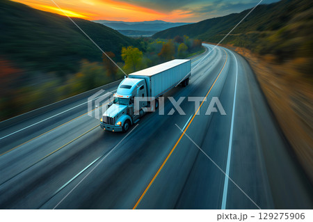 American long-nose semitruck on a highway American long-nose semitruck on a highway 129275906