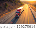 American long-nose semitruck on a highway 129275914