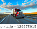 Classic red American long-nose semitruck on a highway 129275915
