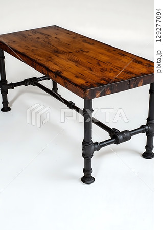 Wooden table with black legs and a black metal frame 129277094