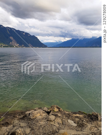 beautiful seascape on the horizon silhouette of mountains 129278009