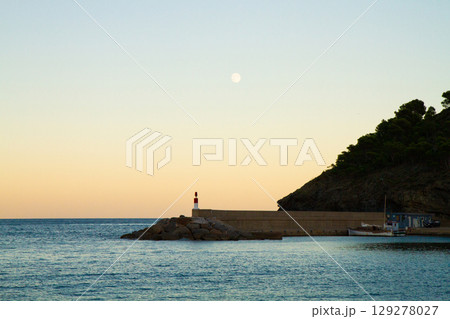 beautiful landscape of sea lighthouse at sunset 129278027