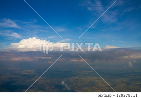 beautiful thick clouds in the sky from the height of the flight of the plane with a view of the continent and countries beautiful thick clouds in the sky from the height of the flight of the plane with a view of the continent and countries 129278311