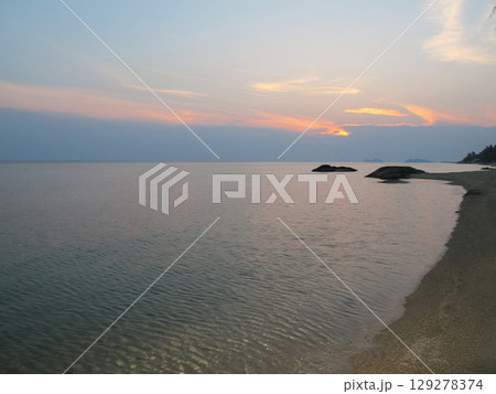 beautiful dramatic landscape of sunset on the sea beach 129278374