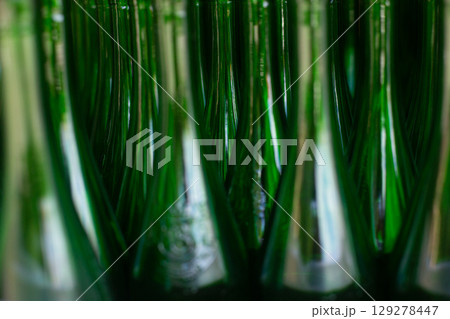 close up of many empty glass green bottles close up of many empty glass green bottles 129278447