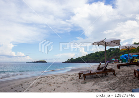 deck chairs and umbrellas on the sea beach in summer 129278466