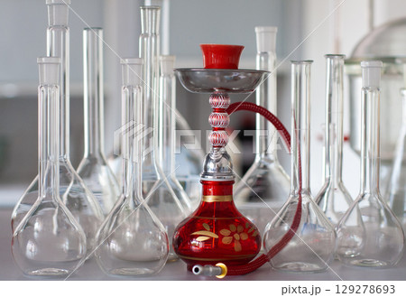 composition of red hookah and chemical glass flasks 129278693