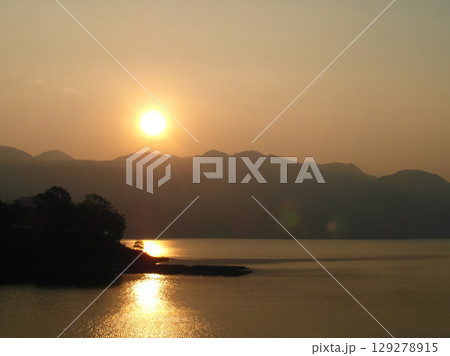 beautiful landscape of mountains on the sea coast at sunset beautiful landscape of mountains on the sea coast at sunset 129278915