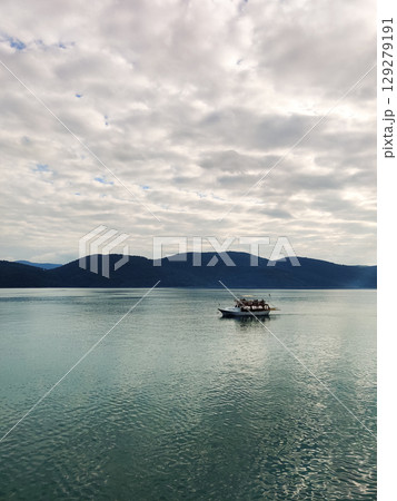 a beautiful ship is sailing in the blue sea 129279191