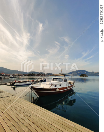 beautiful ships and boats are moored near the shore beautiful ships and boats are moored near the shore 129279197