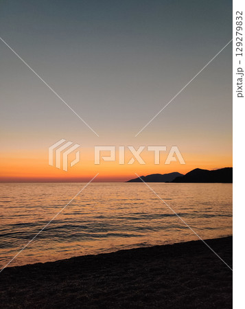 beautiful dramatic landscape of sunset on the sea beach 129279832