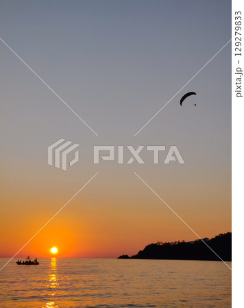 beautiful landscape with a view of the sea flying on a paraglider 129279833
