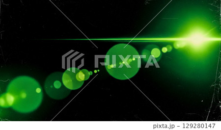 Cinematic lens flare overlay with green light on black background, abstract anamorphic beam with old film texture for video editing and special effect 129280147