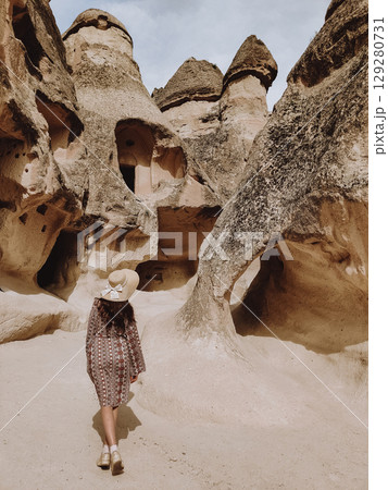 girl on the beautiful mountain scenery in the city Cappadocia in Turkey girl on the beautiful mountain scenery in the city Cappadocia in Turkey 129280731