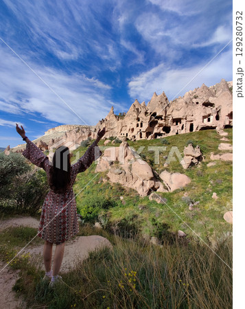 girl on the beautiful mountain scenery in the city Cappadocia in Turkey girl on the beautiful mountain scenery in the city Cappadocia in Turkey 129280732