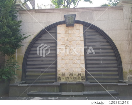 high voltage post over a building 129281248