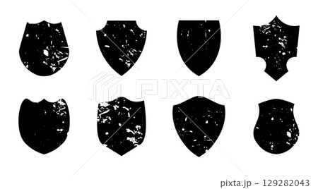 Set of vintage grunge shield shapes with distressed texture and blank space isolated on white background perfect for retro labels stamps and badge designs. Set of vintage grunge shield shapes with distressed texture and blank space isolated on white background perfect for retro labels stamps and badge designs. 129282043
