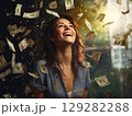 Joyful woman laughing surrounded by money 129282288