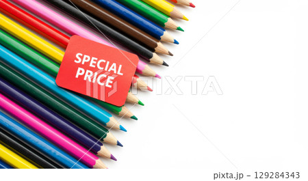 Row of colored pencils with a Special Price tag. Sale on art or school supplies. 129284343
