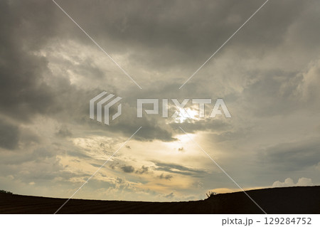 Dramatic Sky with Storm Clouds and Sunlight Dramatic Sky with Storm Clouds and Sunlight 129284752