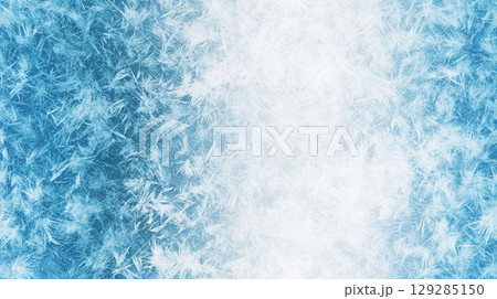Detailed close up of frost patterns on a blue gradient background showcasing intricate ice crystals 129285150