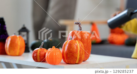 Halloween Decor. Colorful pumpkins arranged for Halloween celebration. 129285237