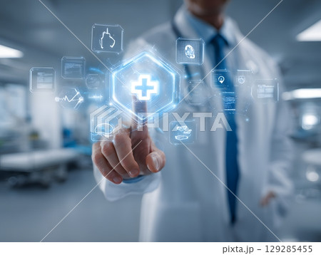 Doctor touches glowing medical cross on digital display. 129285455
