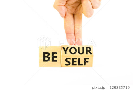 Motivational be yourself symbol. Concept words Be yourself on beautiful wooden block. Beautiful white background Businessman hand. Business motivational be yourself concept. Copy space. 129285719