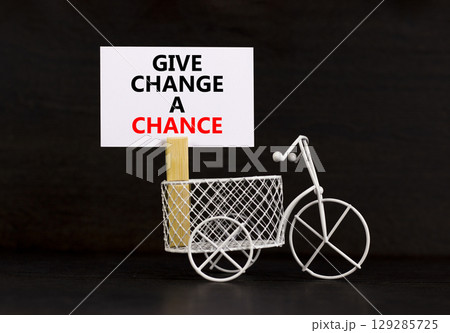 Give change a chance symbol. Concept words phrase Give change a chance on beautiful white paper on clothespin. Beautiful black paper background. Business Give change a chance concept. Copy space. Give change a chance symbol. Concept words phrase Give change a chance on beautiful white paper on clothespin. Beautiful black paper background. Business Give change a chance concept. Copy space. 129285725