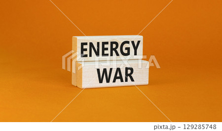 Energy war symbol. Concept words Energy war on beautiful wooden block. Beautiful orange table orange background. Business and Energy war concept. Copy space. Energy war symbol. Concept words Energy war on beautiful wooden block. Beautiful orange table orange background. Business and Energy war concept. Copy space. 129285748