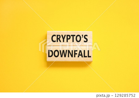 Crypto downfall symbol. Concept words Cryptos downfall on wooden blocks. Beautiful yellow table yellow background. Business and crypto downfall concept. Copy space. Crypto downfall symbol. Concept words Cryptos downfall on wooden blocks. Beautiful yellow table yellow background. Business and crypto downfall concept. Copy space. 129285752