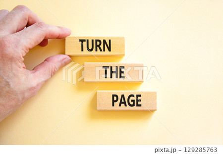 Turn the page symbol. Concept words Turn the page on beautiful wooden block. Businessman's hand. Beautiful white background. Business motivational lifestyle turn the page concept. Copy space. Turn the page symbol. Concept words Turn the page on beautiful wooden block. Businessman's hand. Beautiful white background. Business motivational lifestyle turn the page concept. Copy space. 129285763