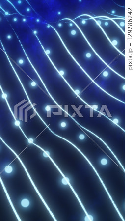 Abstract glowing blue grid with light nodes flowing in wave-like formation on a dark background 129286242