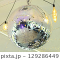 Disco ball in the light of the party. The magic of the mirror ball. 129286449