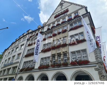 Munich, Germany - July 27, 2025: The building of the men's clothing store in the main square of the city, Hirmer big and tall, a retailer specializing in plus-size menswear 129287446