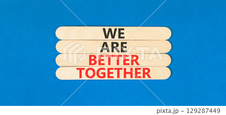 We are better together symbol. Concept words phrase We are better together on beautiful wooden stick. Beautiful blue paper background. Business We are better together concept. Copy space. 129287449