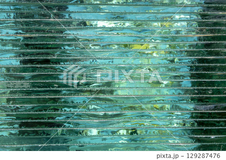 Glass Stacking Side View concept. Glass Factory produces a variety of transparent glass thicknesses. Beautiful typography background. Copy space. 129287476