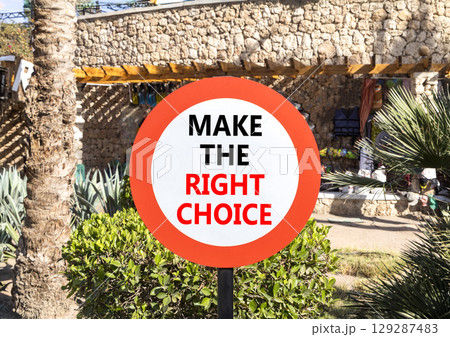 Make the right choice symbol. Concept words phrase Make the right choice on beautiful road sign. Beautiful palm tree background. Business Make the right choice concept. Copy space. Make the right choice symbol. Concept words phrase Make the right choice on beautiful road sign. Beautiful palm tree background. Business Make the right choice concept. Copy space. 129287483