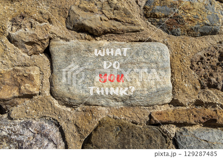 What do you think symbol. Concept words What do you think on beautiful grey stone. Beautiful stone wall background. Business and What do you think concept. Copy space. 129287485
